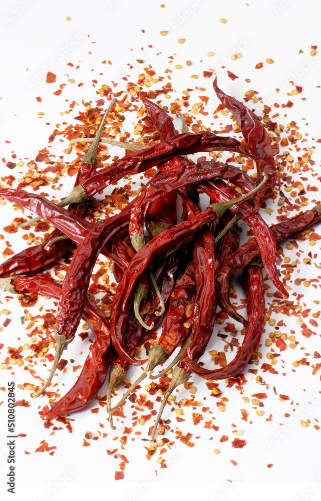 Obraz premium hot cayenne spicy paprika chili peper on wood table.