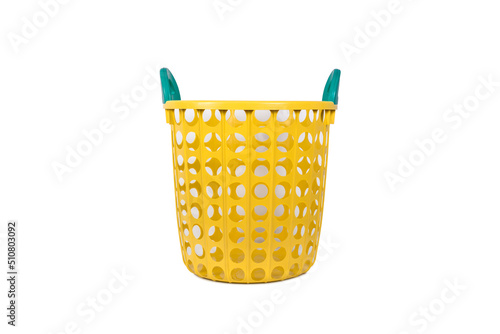 Yellow plastic empty laundry basket with green handle isolated on white background.