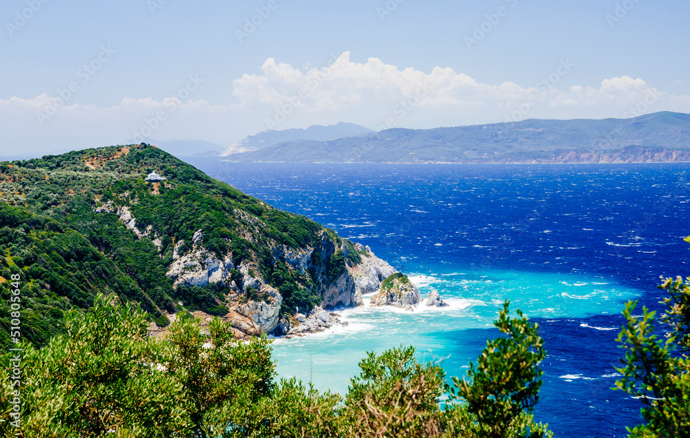 Mediterranean hidden places at Kastro, Skiathos island, Greece. Beautiful vivid panorama view of blue aegean sea coast from wild cliff.  Summer holiday vacation tour.