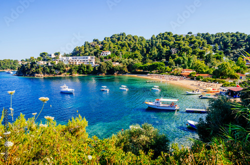 Troulos beach, Skiathos island, Greece. Beautiful vivid panorama view of blue aegean sea coast from wild cliff.  Summer holiday vacation tour to greek islands. photo