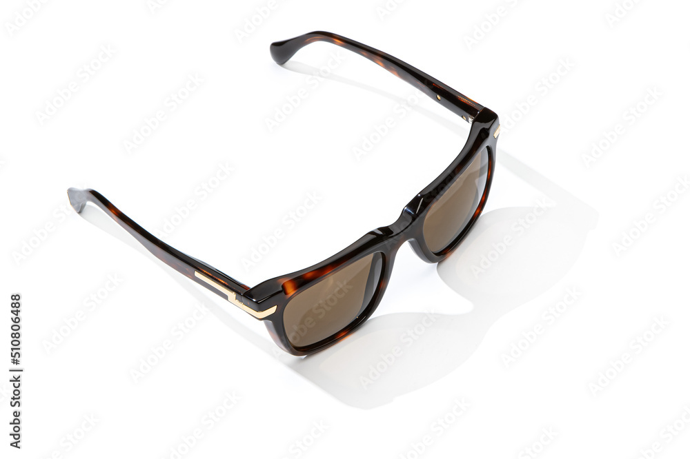 Summer sunglasses in sunlight isolated on white background. Modern stylish sunglass for holiday vacation. Fashion female black leopard glasses. Summer sunglasses in sunlight isolated on white background. Modern stylish sunglass for holiday vacation. Fashion female black leopard glasses.