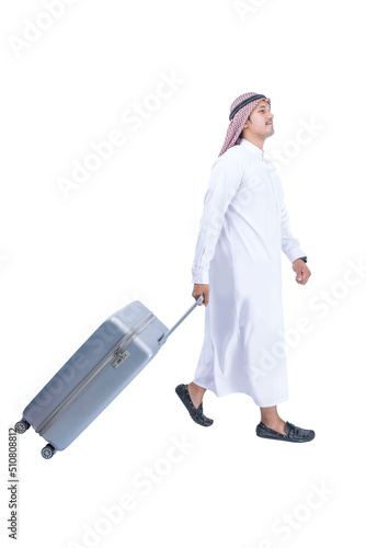 Arab man wearing keffiyeh walking with a suitcase for traveling