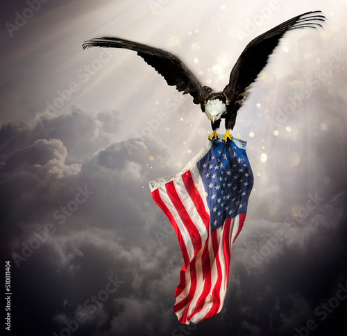 Fototapet Eagle With American Flag Flies In The Sky With Blurred Bokeh And Sunlight Effect