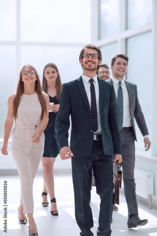 businessman walking in front of his business team businessman walking in front of his business team