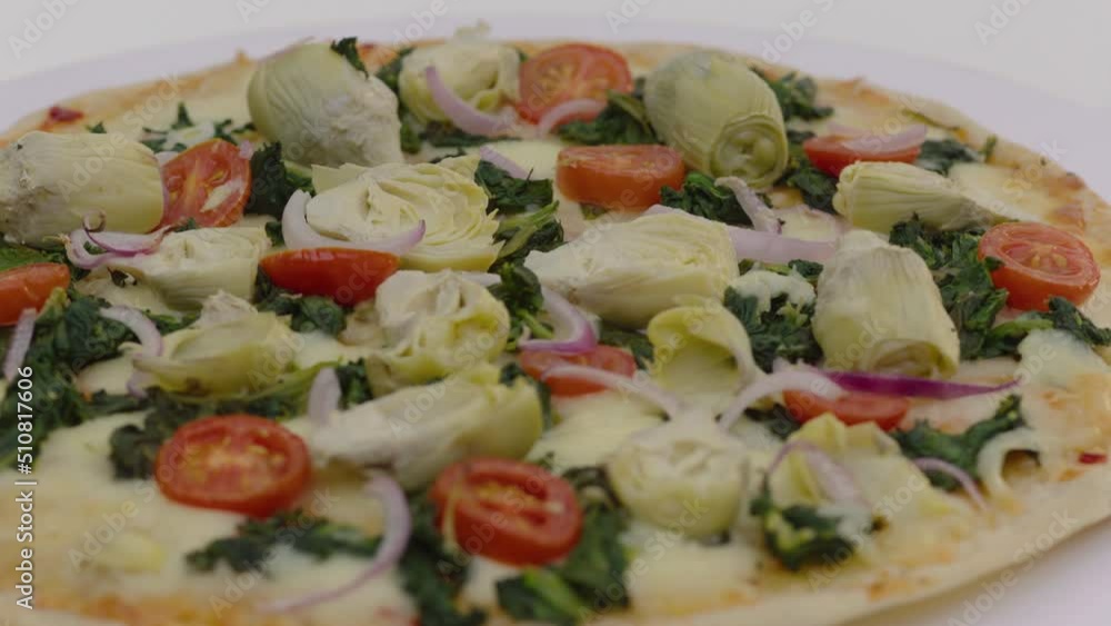 a nice pizza in front of a white background a nice pizza in front of a white background