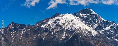 panorama of beautiful and snowy Caucasus mountains in the sunny weather, Kazbegi, Georgia. High quality photo © PoppyPix