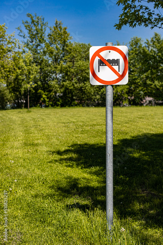 there is a sign on the lawn that says no grilling