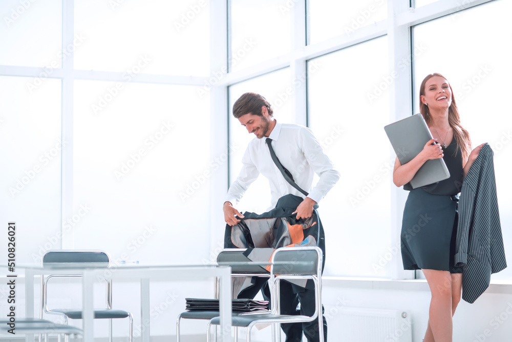 tired young employees at the end of the day in the office tired young employees at the end of the day in the office