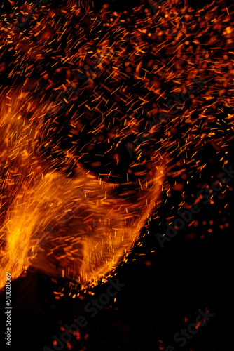 flames of fire with sparks on a black background