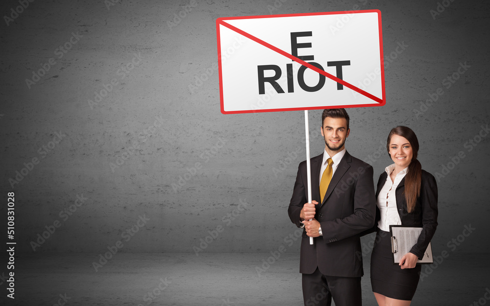 business person holding a traffic sign business person holding a traffic sign