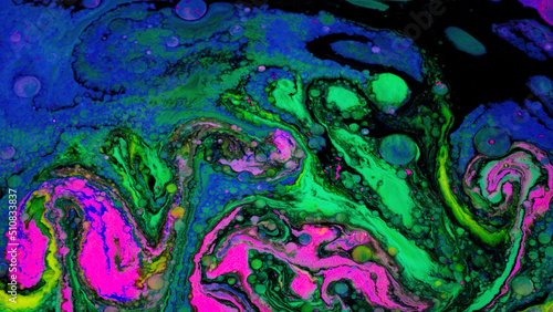 Bright fluid art with acidic colors and bubbles. Stock footage. Liquid mixing patterns of bright colors with bubbles on flat surface. Acidic colorful patterns