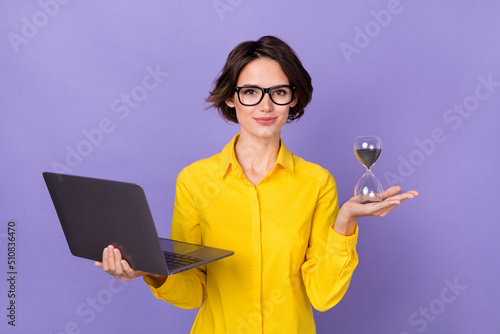 Photo of nice hr millennial lady hold laptop watches wear yellow outfit eyewear isolated on violet color background photo
