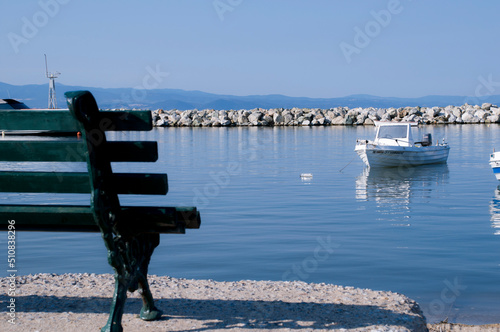 Sitting on the bench by the beach