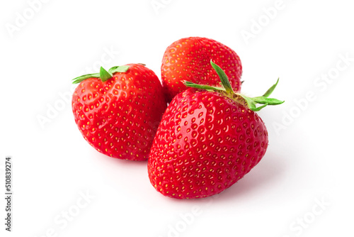 Three strawberries on a white background. Fresh ripe fruits, close up