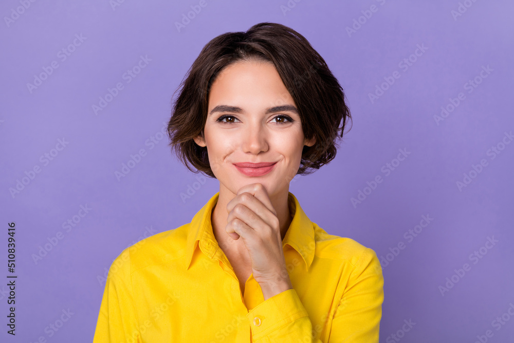 Photo of thinking millennial lady hand face wear yellow shirt isolated on purple color background Photo of thinking millennial lady hand face wear yellow shirt isolated on purple color background