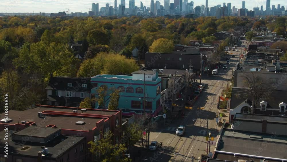 Modest traffic on the streets of Eastside Toronto: cars are moving slowly. Mesmerizing city skyline is visible on a sunny day Modest traffic on the streets of Eastside Toronto: cars are moving slowly. Mesmerizing city skyline is visible on a sunny day