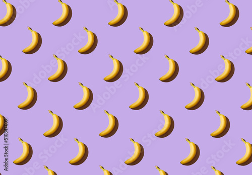 Texture of bananas on a purple background, banana pattern