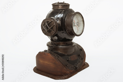 A watch in the shape of an antique diving helmet.
