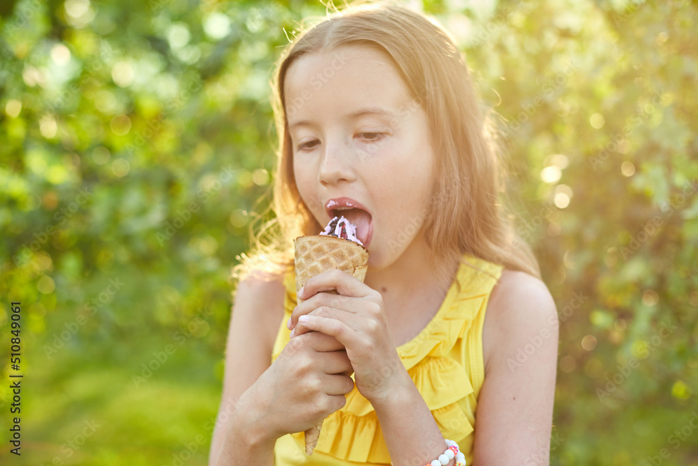 Happy girl with braces eating italian ice cream cone smiling while resting in park on summer day Happy girl with braces eating italian ice cream cone smiling while resting in park on summer day