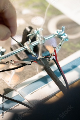 A man putting wires together