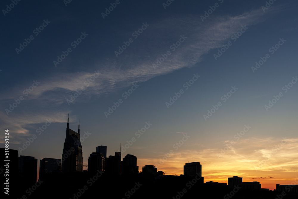 Silhouette skyline of downtown Nashville along the Cumberland River.