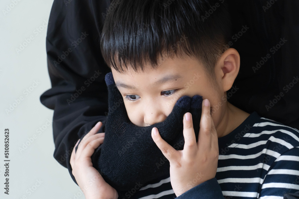 Asian boy Being kidnapped By the kidnapper wearing a mask in black ...