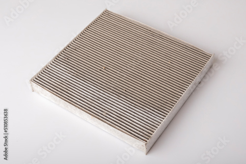 Old car cabin air filter. Protection against allergens, pollen, dust mites, odors, dirt, soot, bacteria, viruses. Car spare parts concept