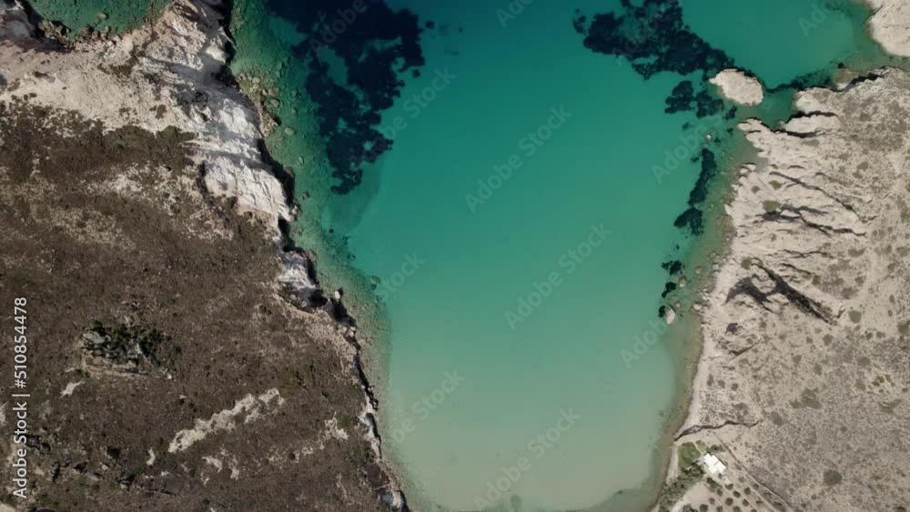 Aerial shot of a relaxing Greek beach on the Mediterranean. Summertime Milos Greece 4k. Aerial shot of a relaxing Greek beach on the Mediterranean. Summertime Milos Greece 4k.