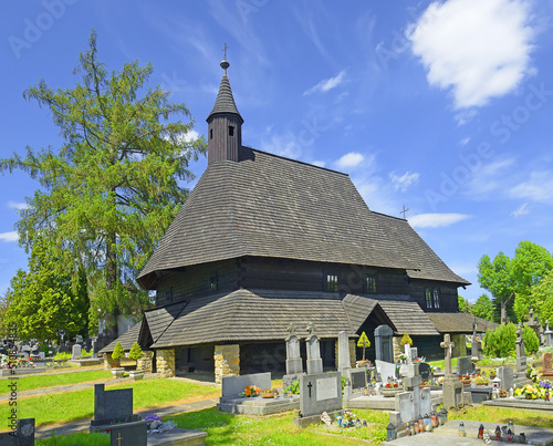 Tvrdosin, Slovakia - Gothic wooden church of All Saints with baroque altar in Tvrdosin town. This 15th century church is UNESCO World Heritage Site photo