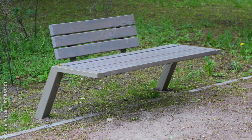 Modern wooden grey park bench for relaxation Modern wooden grey park bench for relaxation