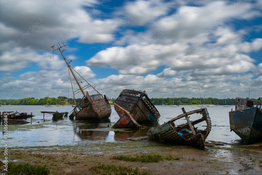 view of the boat graveyard at Pin Mill on the River Orwell in Suffolk at low tide