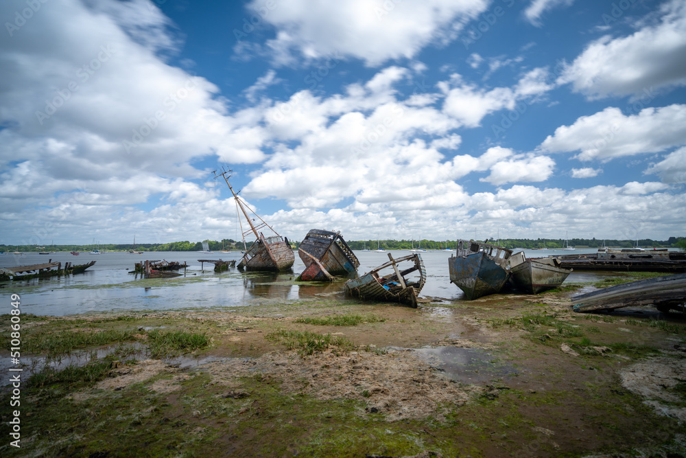 view of the boat graveyard at Pin Mill on the River Orwell in Suffolk at low tide