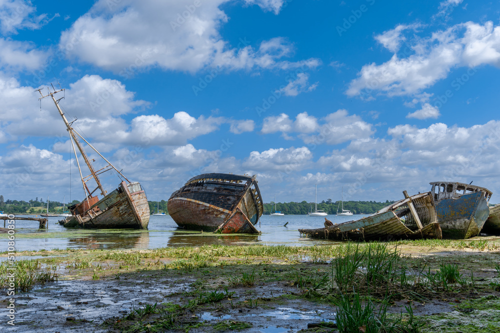 view of the boat graveyard at Pin Mill on the River Orwell in Suffolk at low tide view of the boat graveyard at Pin Mill on the River Orwell in Suffolk at low tide