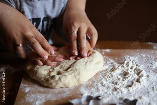 hands kneading dough