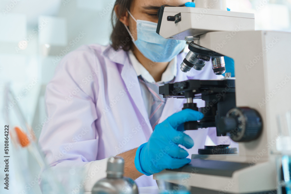 Laboratory research concept, Scientist working in lab with microscope to research drug and vaccine Laboratory research concept, Scientist working in lab with microscope to research drug and vaccine