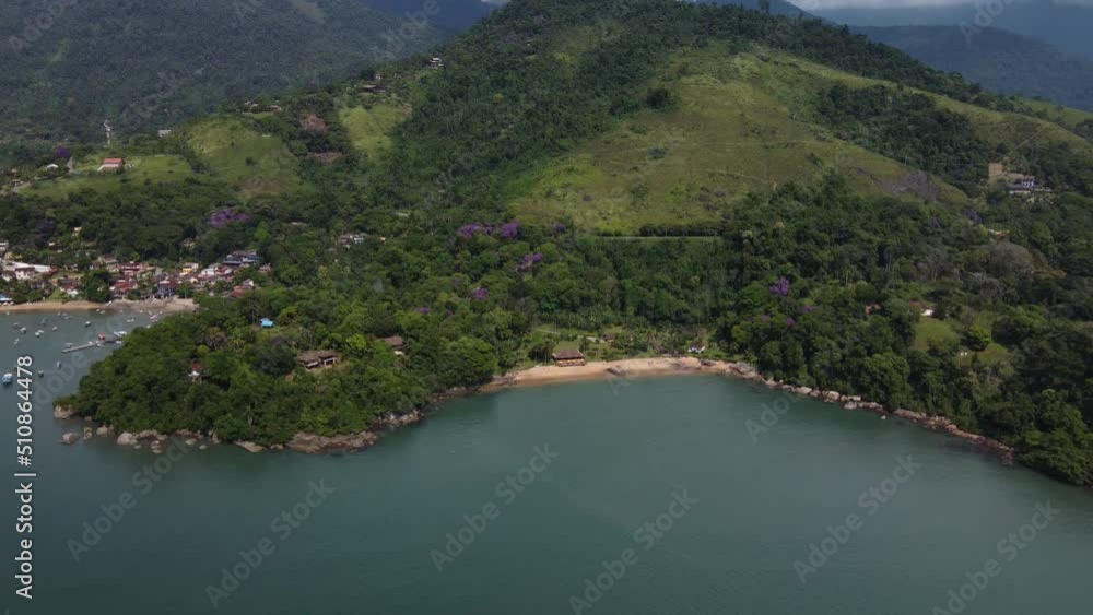 Aerial view to a small beach with the atlantic forest at the coast of Paraty, Rio de Janeiro - Brasil Aerial view to a small beach with the atlantic forest at the coast of Paraty, Rio de Janeiro - Brasil