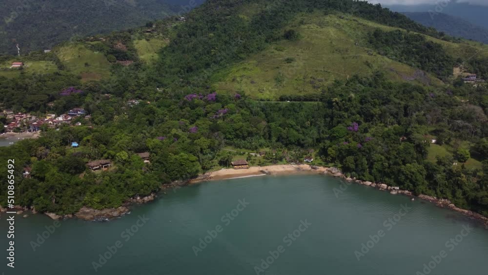 Aerial view to a small beach with the atlantic forest at the coast of Paraty, Rio de Janeiro - Brasil Aerial view to a small beach with the atlantic forest at the coast of Paraty, Rio de Janeiro - Brasil