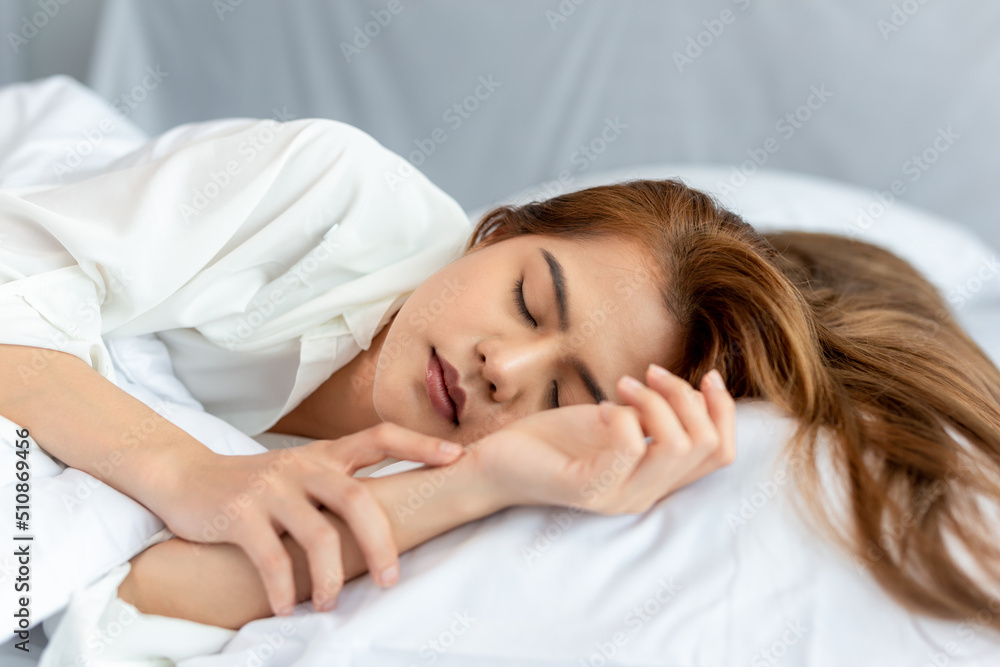 Portrait of beautiful woman blonde hair lying on her bed at home. Portrait of beautiful woman blonde hair lying on her bed at home.