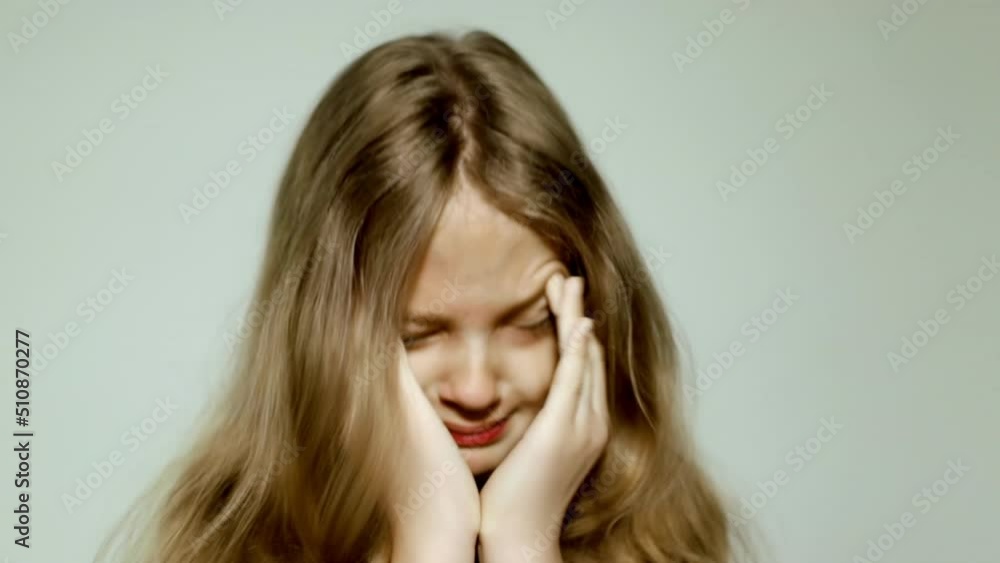 Sum. Young girl crying covering face with hands. Emotional state of man Sum. Young girl crying covering face with hands. Emotional state of man