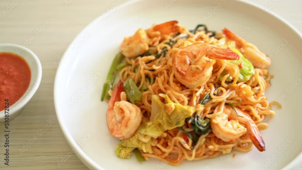 Stir-fried instant noodles sukiyaki with shrimps - Asian food style Stir-fried instant noodles sukiyaki with shrimps - Asian food style