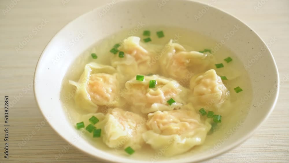 shrimp dumpling soup in white bowl - Asian food style shrimp dumpling soup in white bowl - Asian food style