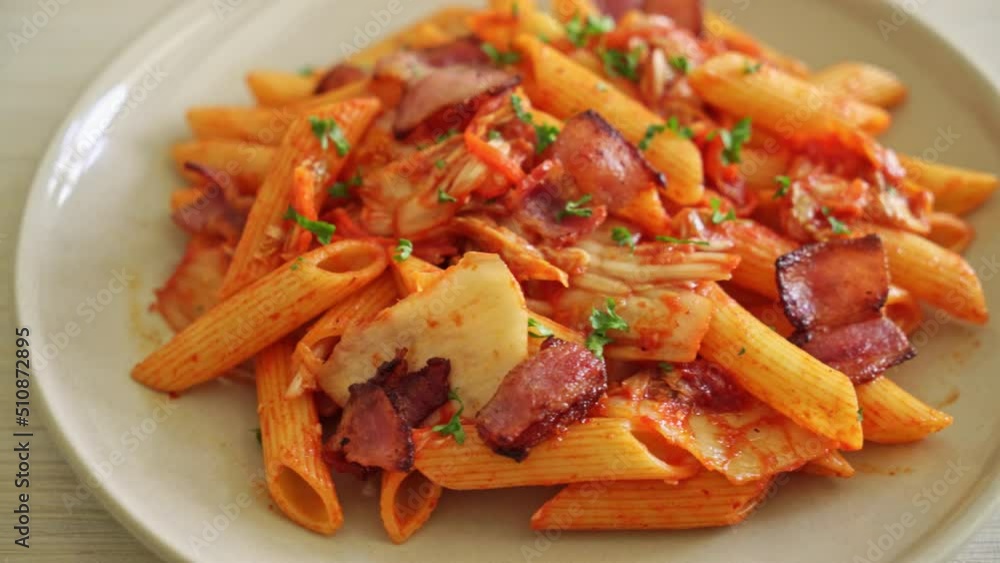 stir-fried penne pasta with kimchi and bacon - fusion food stir-fried penne pasta with kimchi and bacon - fusion food