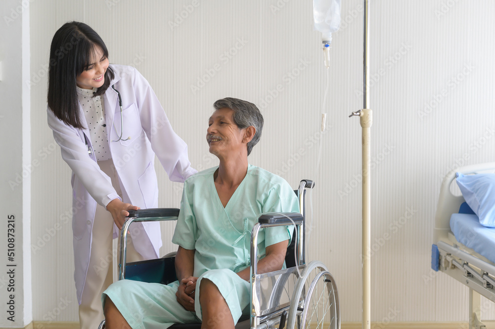 Doctor helping senior patient man moving to wheelchairs at hospital, health care and medical concept.. Doctor helping senior patient man moving to wheelchairs at hospital, health care and medical concept..