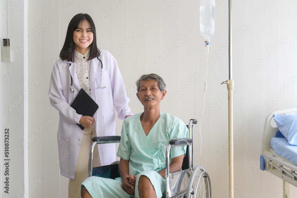 Doctor helping senior patient man moving to wheelchairs at hospital, health care and medical concept.. Doctor helping senior patient man moving to wheelchairs at hospital, health care and medical concept..