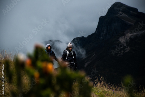 Latin hikers enjoying a walk in a cloudy afternoon