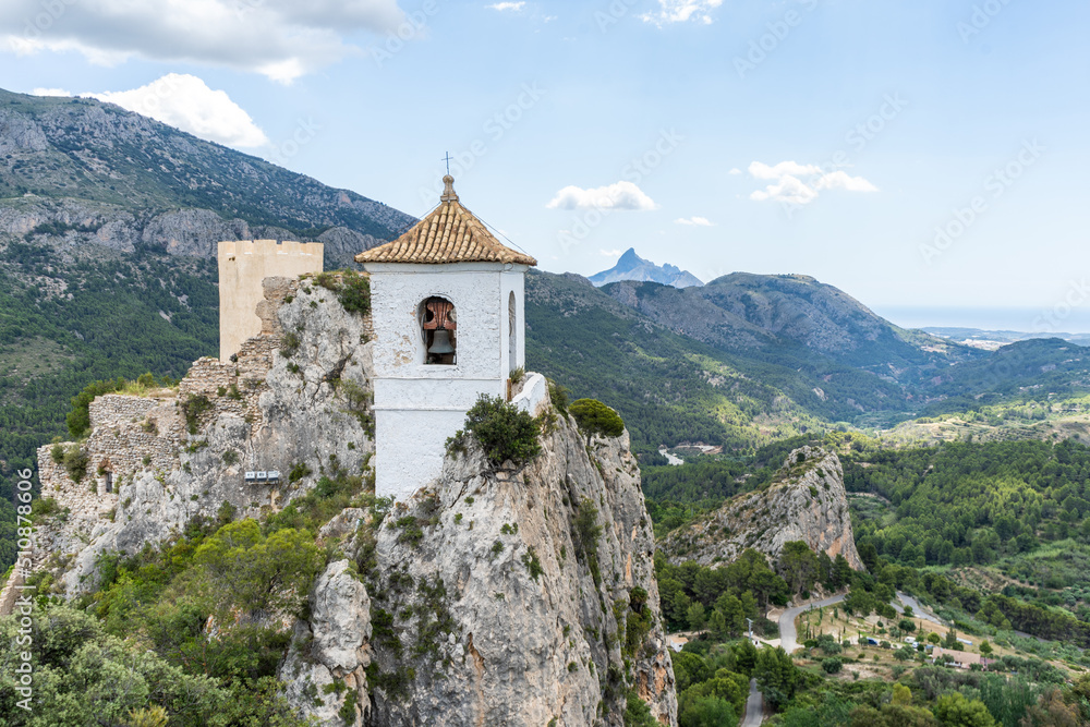 Sight of the old bell tower on the top of the rock of the village of Guadalest in Province of Alicante, Spain