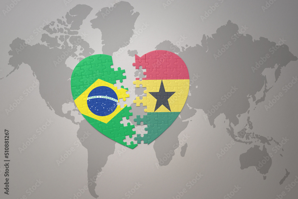 puzzle heart with the national flag of brazil and ghana on a world map background.Concept.