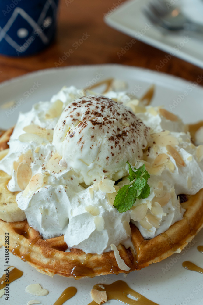 Ice cream on waffles and whipped cream around... Ice cream on waffles and whipped cream around...