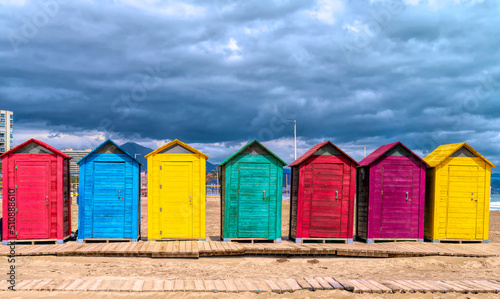 Beach huts in Spain bright colours with red green blue yellow purple © acceleratorhams