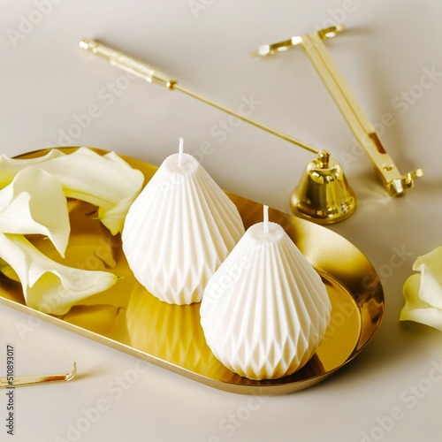 Elegant wax candles and accessory set. photo